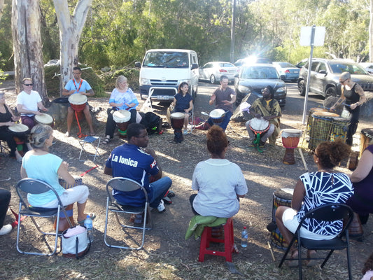 African djembe drumming jam / drum circle led by Mady Keita