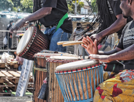 African drumming entertainment at community market event