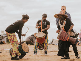 West African drummers for mental health at beach